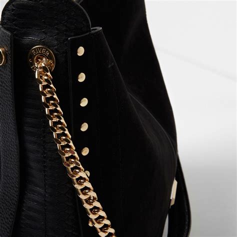 black studded oversized slouch bag.